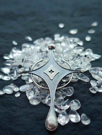 Cyrene Axiom Cross handcrafted 925 sterling silver earring flat lay, cross detail with hollow diamond center