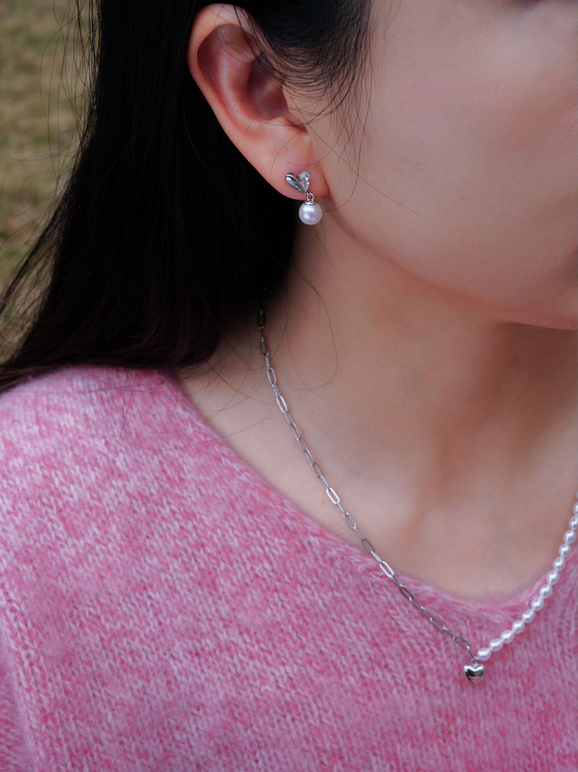 Clean aesthetic styling featuring Cyrene's everyday hand-selected freshwater pearl earrings paired perfectly with a cozy sweater