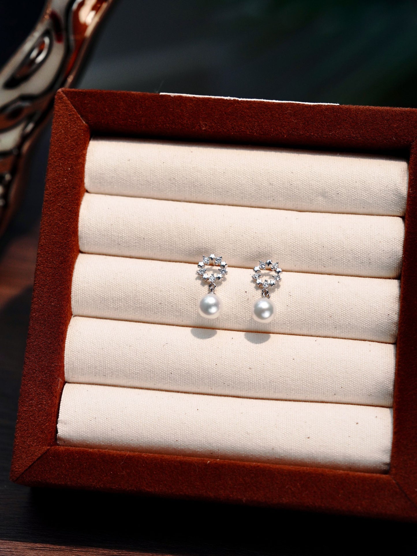 Dainty crown freshwater pearl drop earrings by Cyrene, offering exquisite everyday elegance in a velvet box