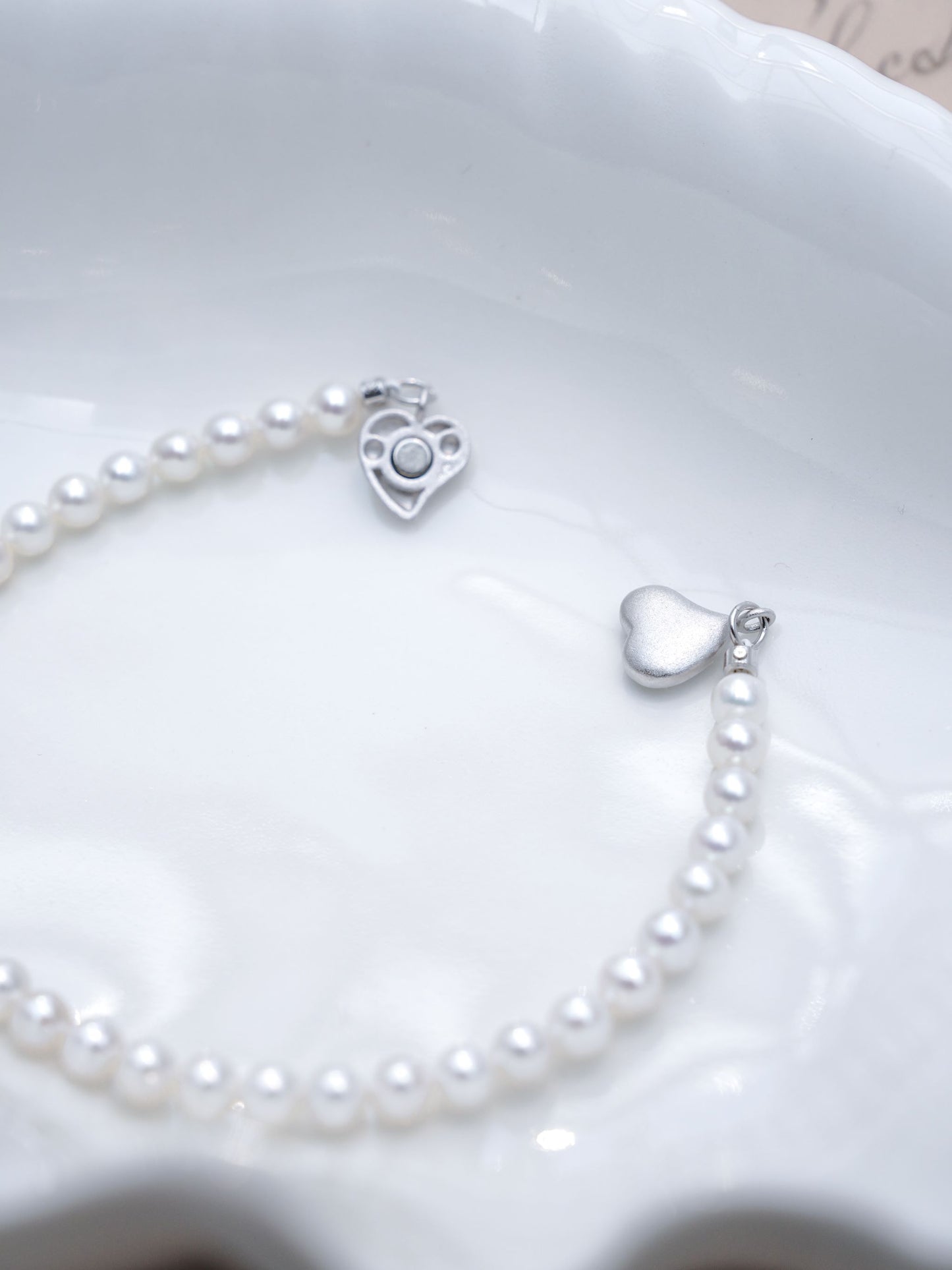 An elegant full strand mini freshwater pearl bracelet by Cyrene, offering a clean, minimalist, and gentle aesthetic.