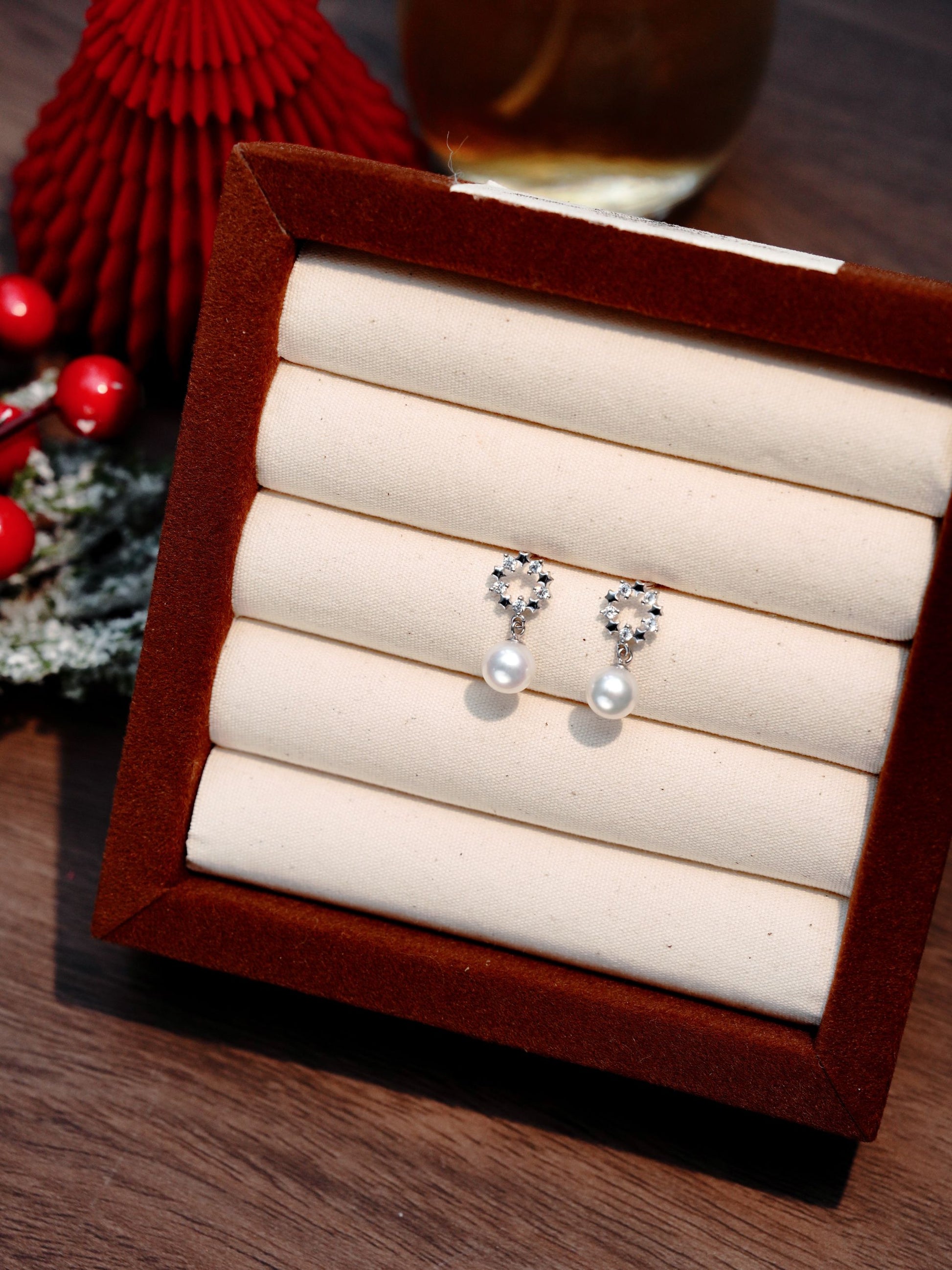 Elegant high-luster 7-8mm freshwater pearl earrings featuring a sparkling tiara design by Cyrene