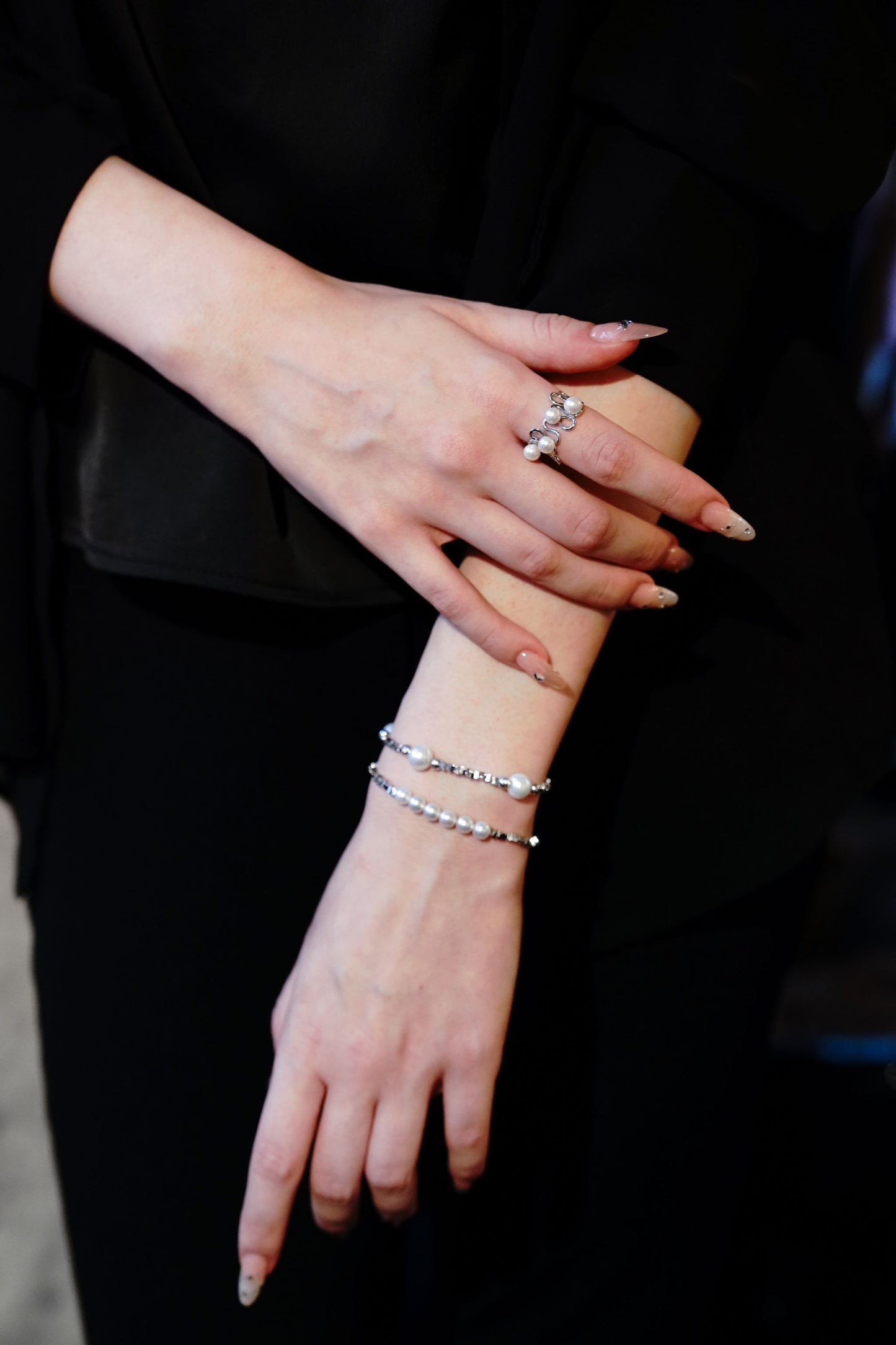 An everyday chic bracelet by Cyrene that perfectly balances the softness of pearls with the sharp aesthetic of geometric silver.