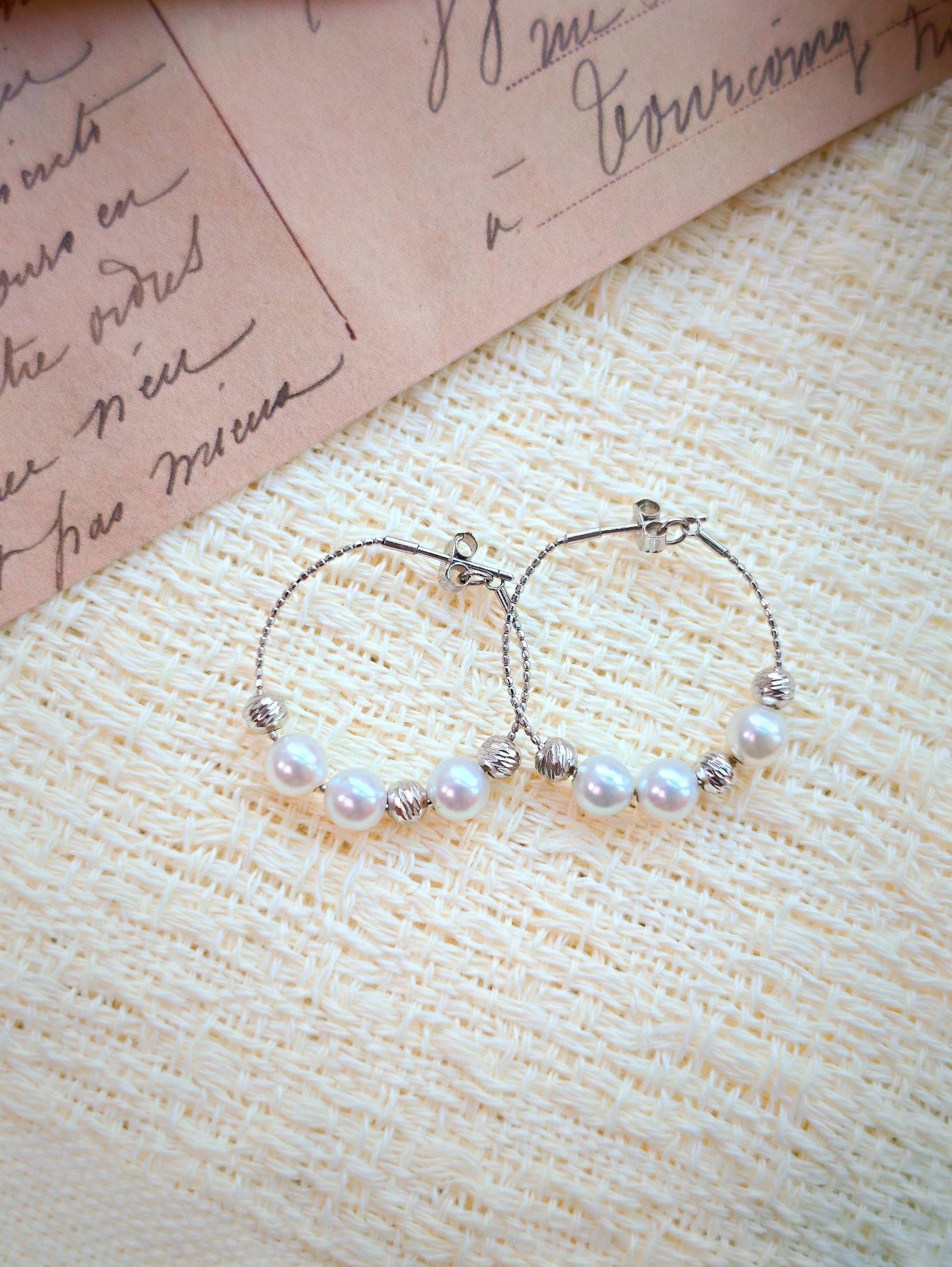 Cyrene Halo Pearl Hoop Earring pair front view, 925 silver wire hoop with freshwater pearl detail