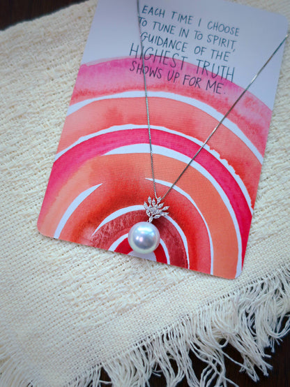 Cyrene Lone Drop Pearl Pendant on illustrated card — 18K white gold CZ leaf pendant with rare silver-blue South Sea pearl