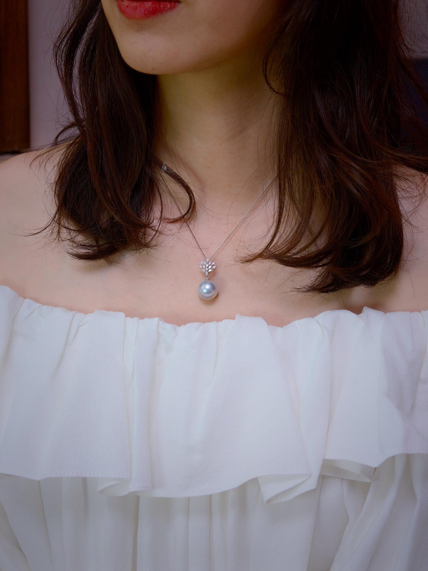 Cyrene Lone Drop Pearl Pendant worn on neck — South Sea pearl pendant with white ruffled top, lifestyle shot