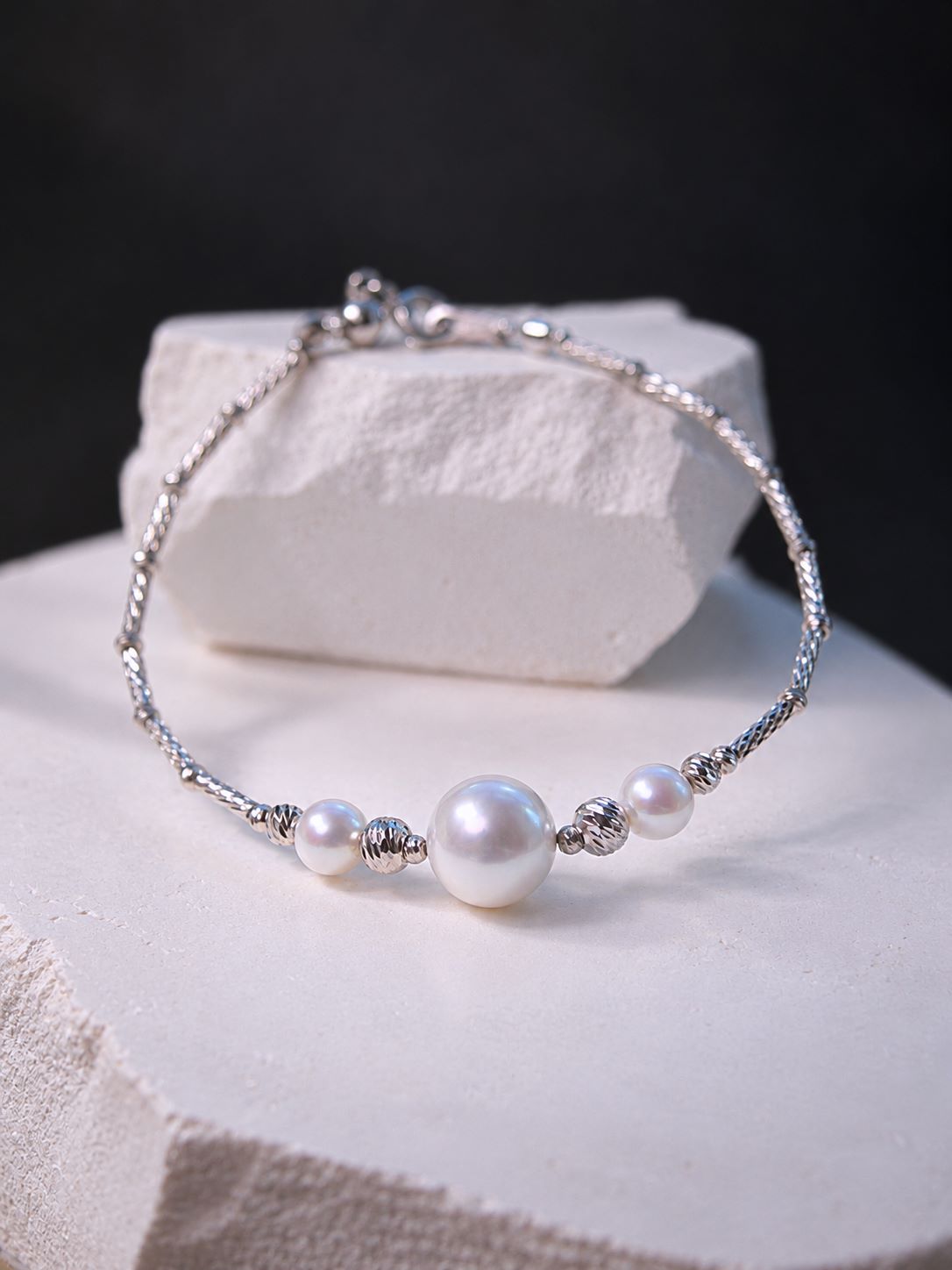 Moirae Pearl Bar Bracelet shown in full, with three freshwater pearls and a textured 925 sterling silver tube chain