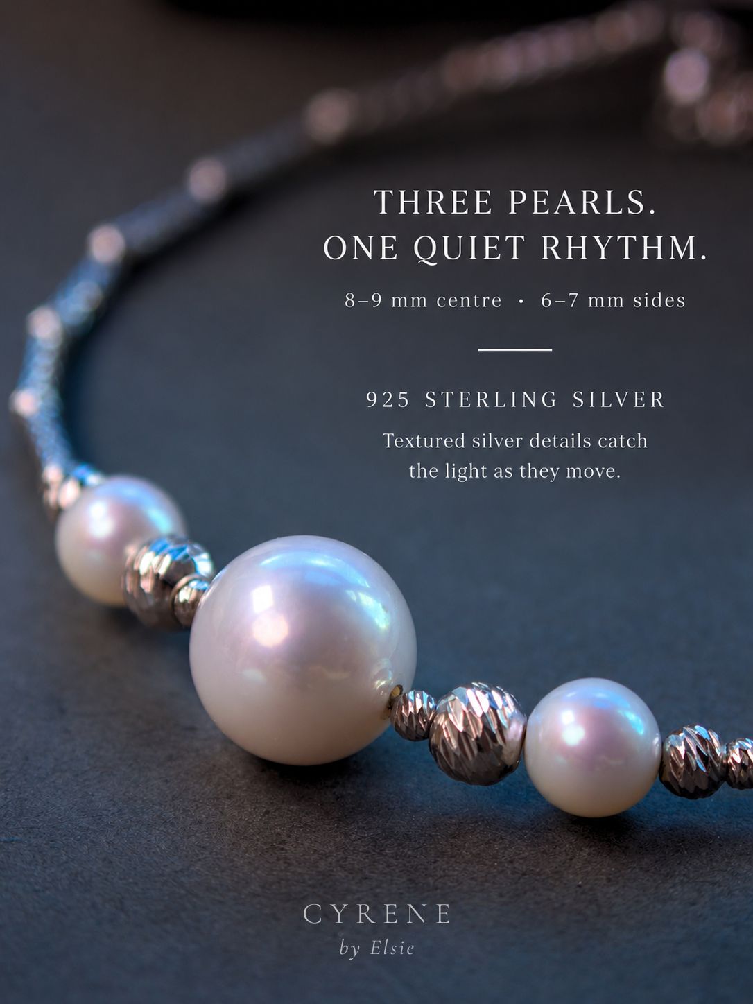 Close-up of the Moirae Pearl Bar Bracelet showing its three-pearl composition and textured 925 sterling silver tube chain