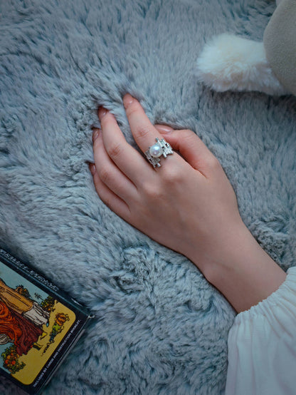 Cyrene by Elsie Palisade Pearl Ring worn on hand styled with a tarot card flat lay