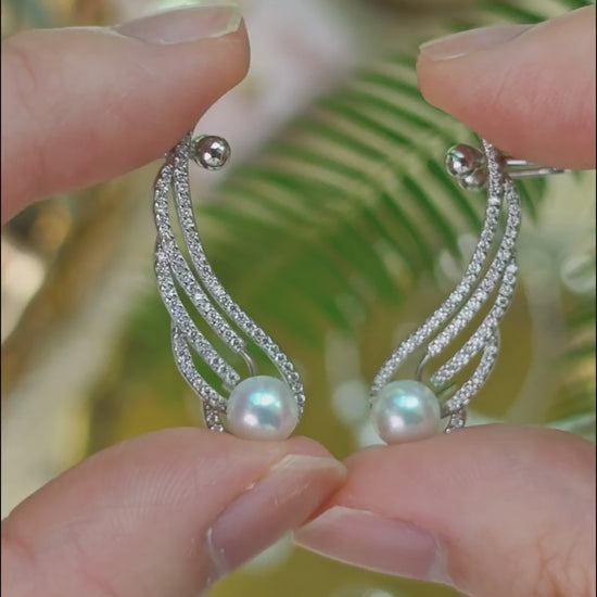 Close-up video of the Featherrise Wing Ear Climber showing its pearl and pavé CZ details, back structure and how the adjustable ear cuff is worn