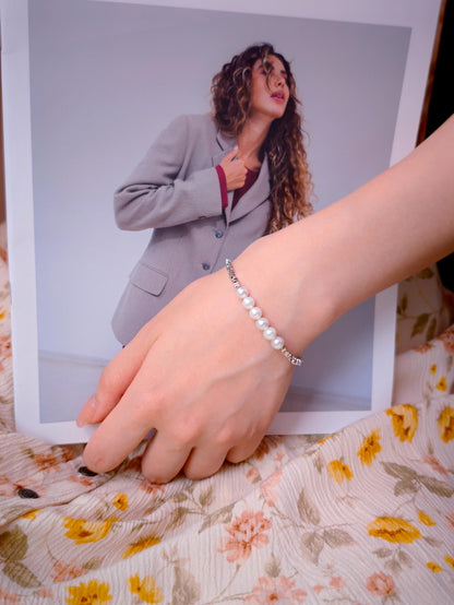 Model wearing Cyrene Relic Fragment Pearl Bracelet, 925 silver and freshwater pearl bracelet on wrist