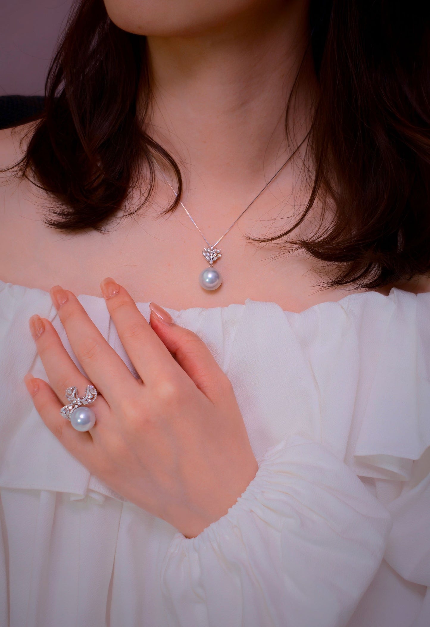 Cyrene Solitaire Bow Pearl Ring and Lone Drop Pearl Pendant styled on model — South Sea pearl ring and pendant set, lifestyle shot