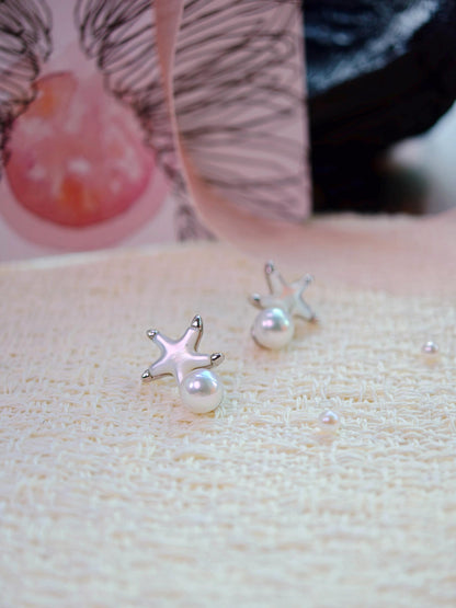 Cyrene Starshore Pearl Earrings — 925 silver starfish and freshwater pearl stud earrings, angled detail shot
