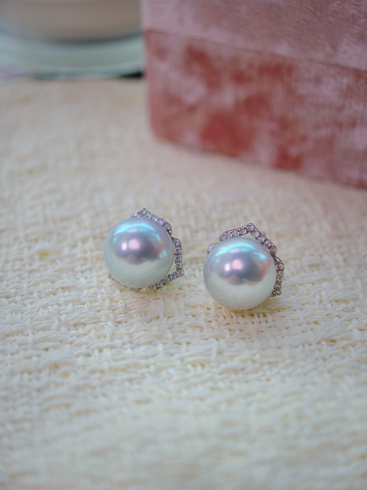 Cyrene Trio Bloom Pearl Earrings close-up — matched pair of 12.2mm South Sea pearls with petal jacket detail