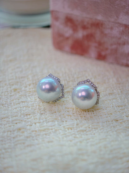 Cyrene Trio Bloom Pearl Earrings close-up — matched pair of 12.2mm South Sea pearls with petal jacket detail