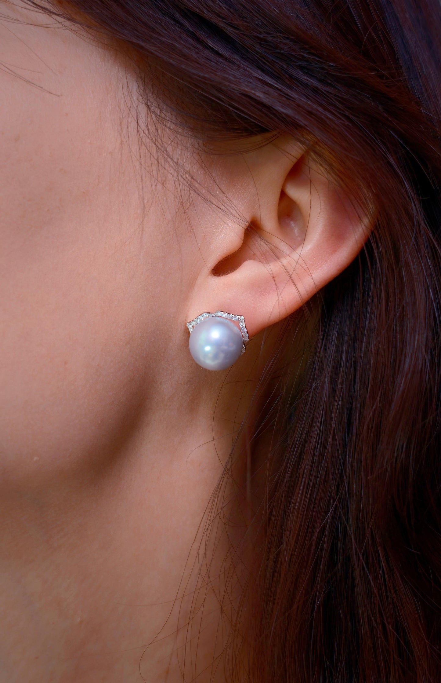 Cyrene Trio Bloom Pearl Earrings worn on ear with petal jacket — South Sea pearl and CZ detail