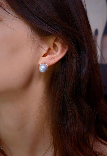 Cyrene Trio Bloom Pearl Earrings worn as plain stud without jacket — South Sea pearl on ear, close-up